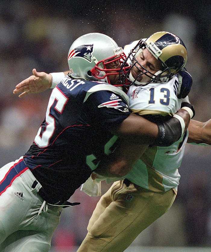 2002-0203-Super-Bowl-XXXVI-Willie-McGinest-Kurt-Warner-001280494r.jpg